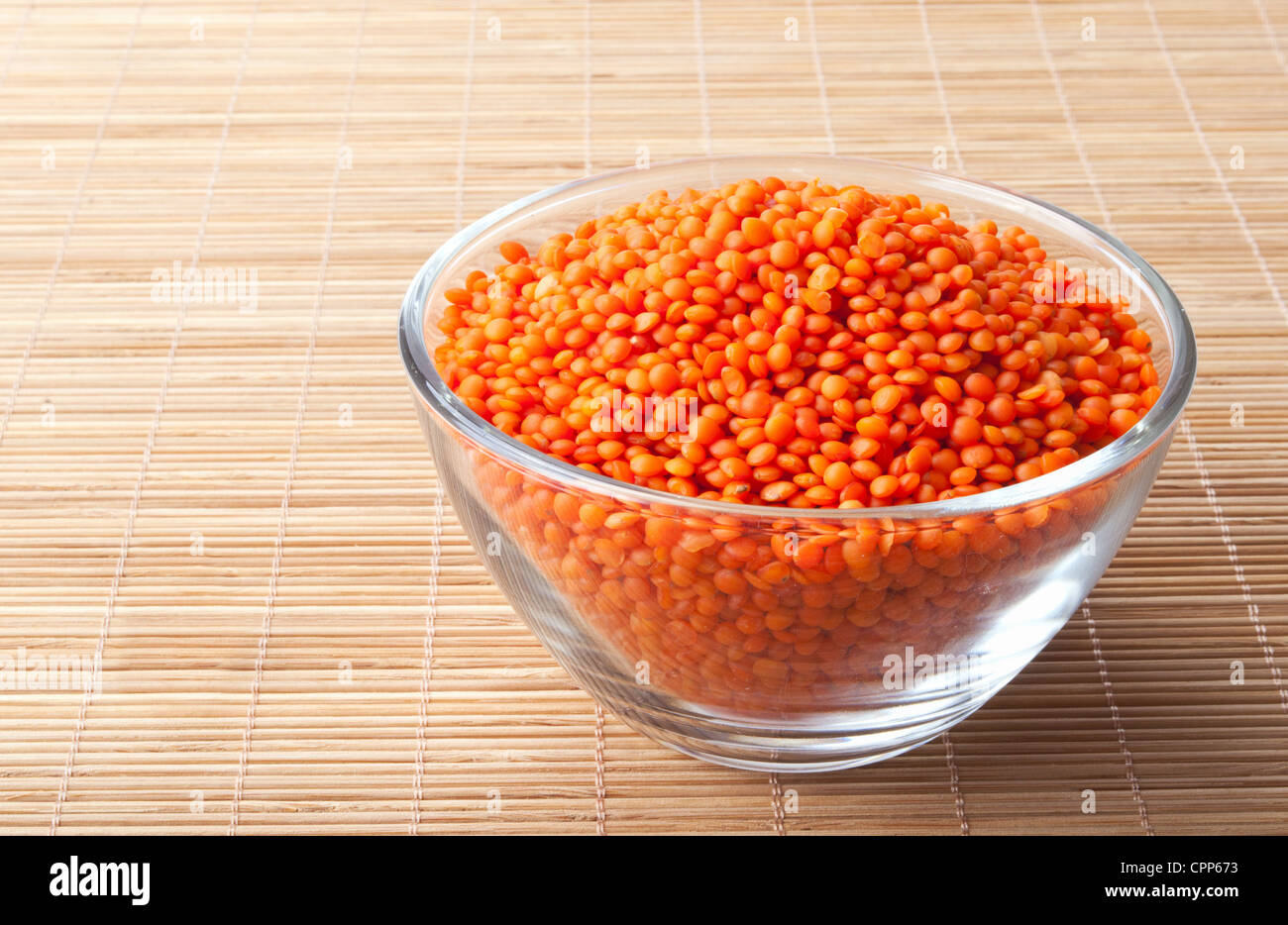 glass bowl full of red lentils Stock Photo