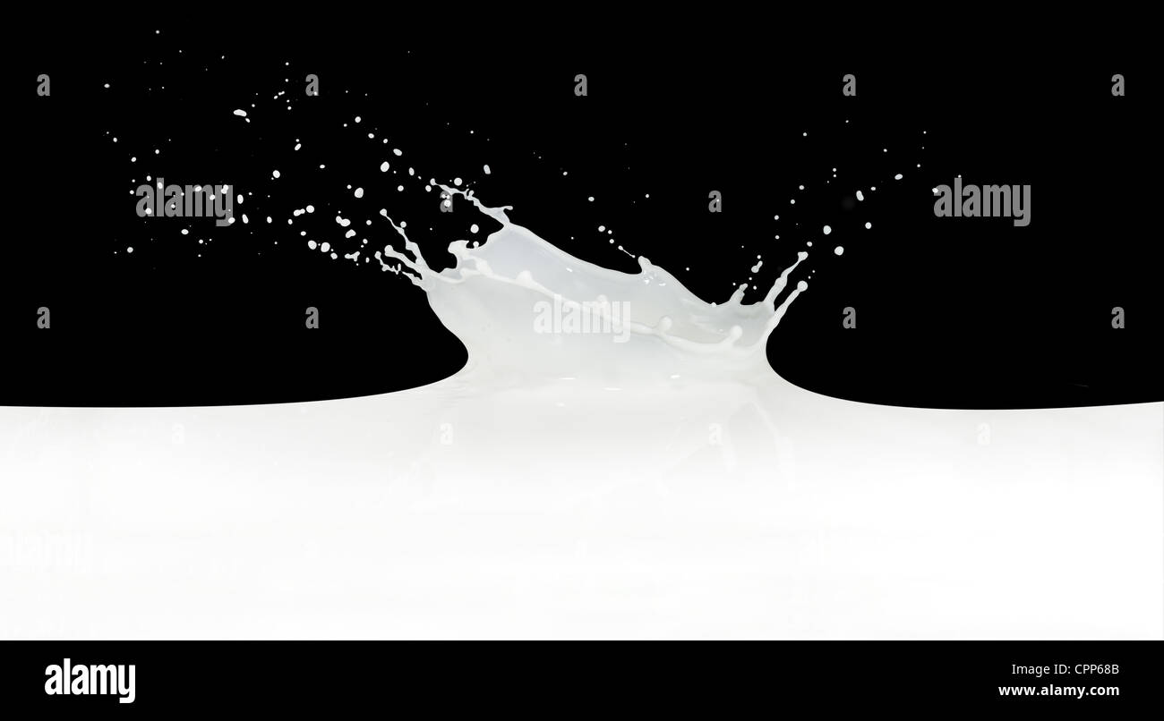 splashing milk isolated on black background Stock Photo - Alamy
