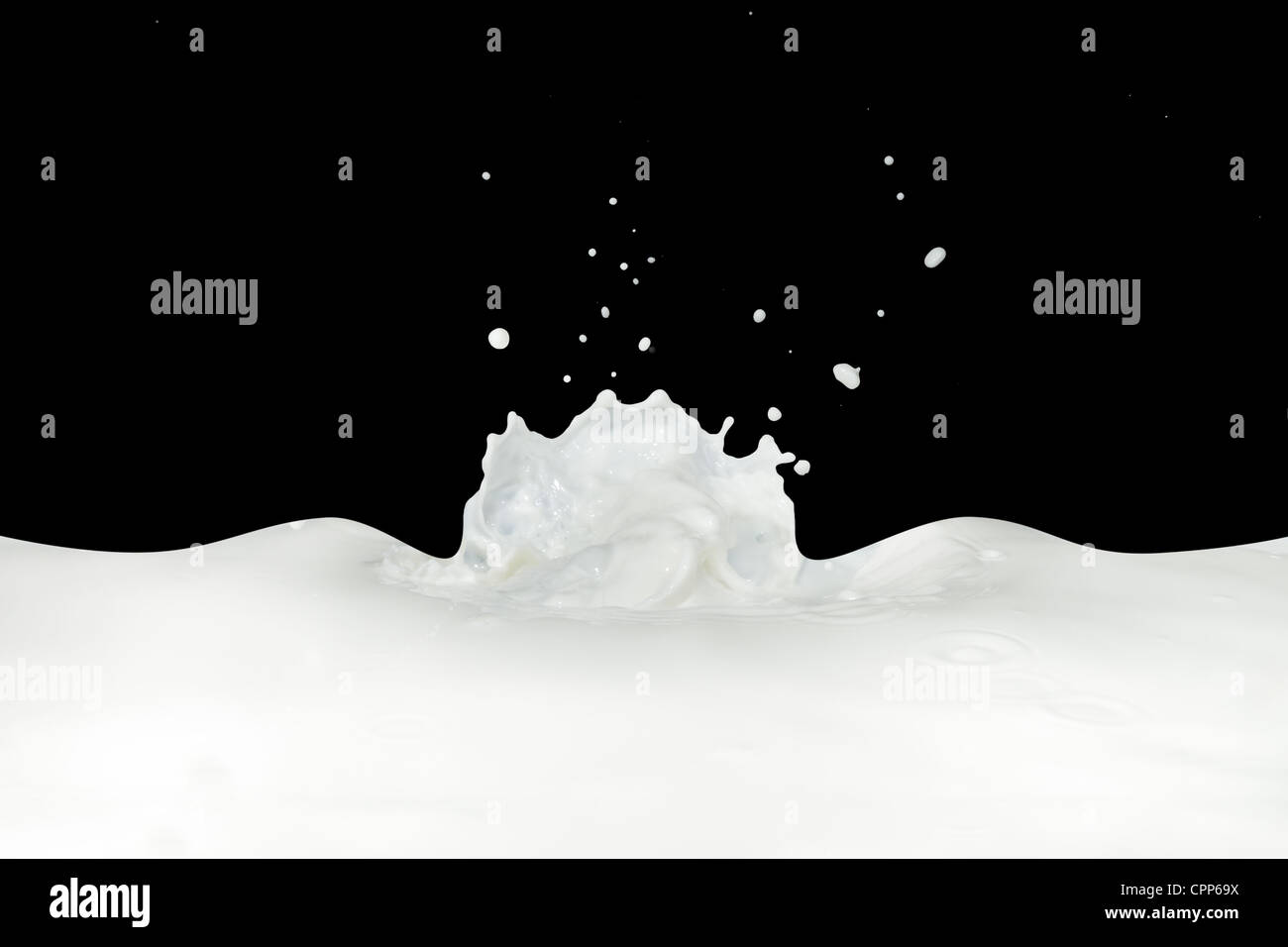splashing milk isolated on black background Stock Photo - Alamy