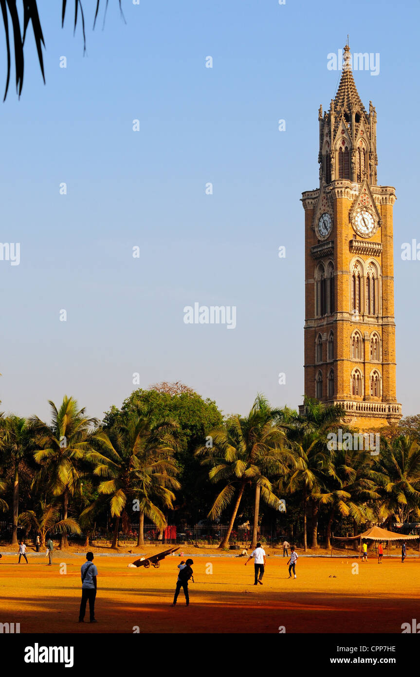 Rajabai Clock Tower and cricket on Oval Maiden, Mumbai, India Stock Photo
