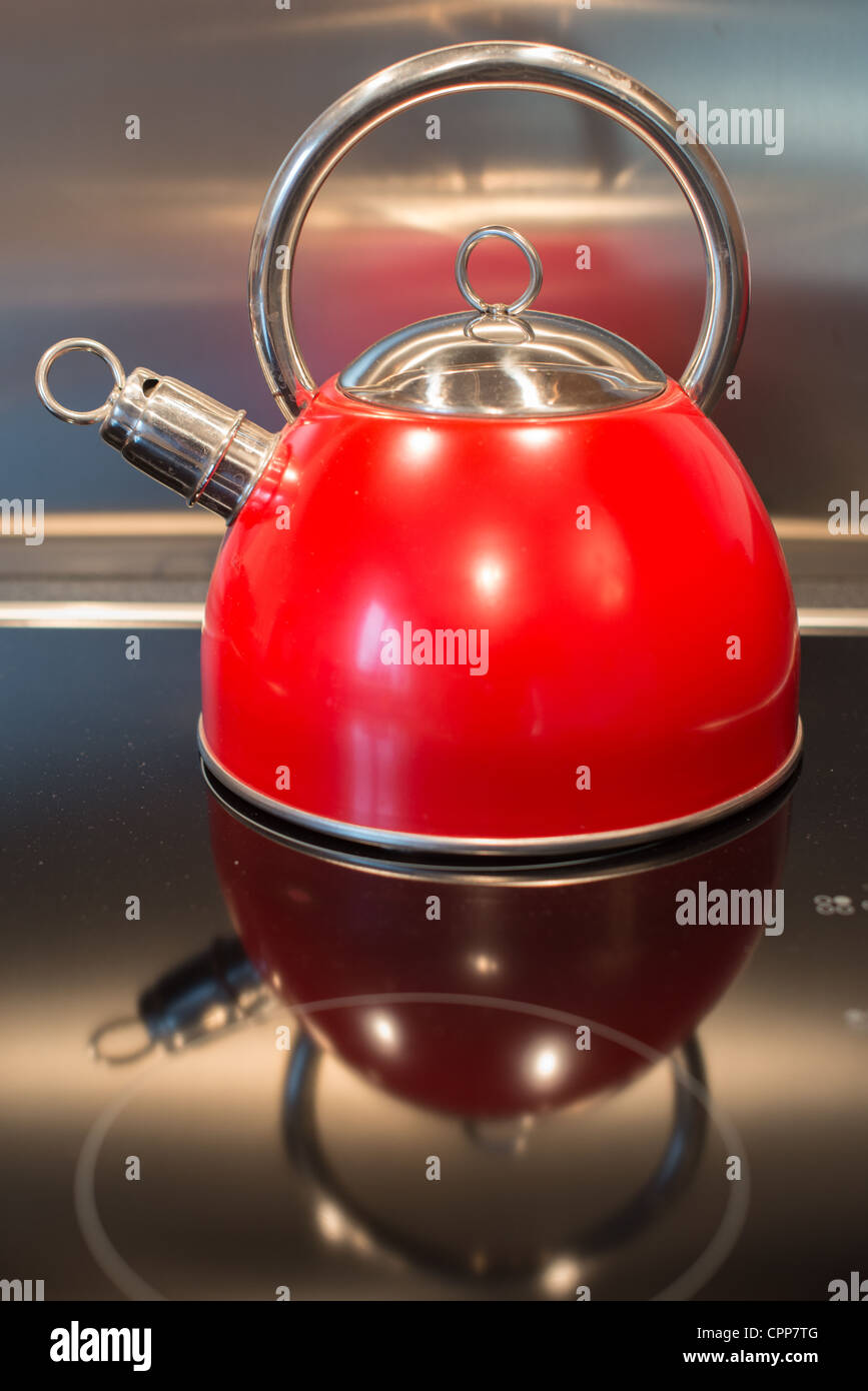 Red Kettle on stove Stock Photo Alamy
