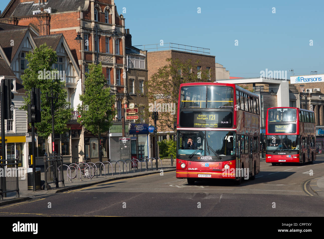 Red London buses in the Enfield town. England. Stock Photo