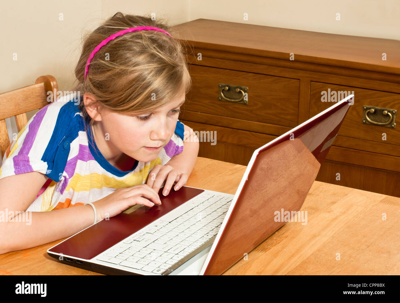 Girl using laptop Stock Photo - Alamy