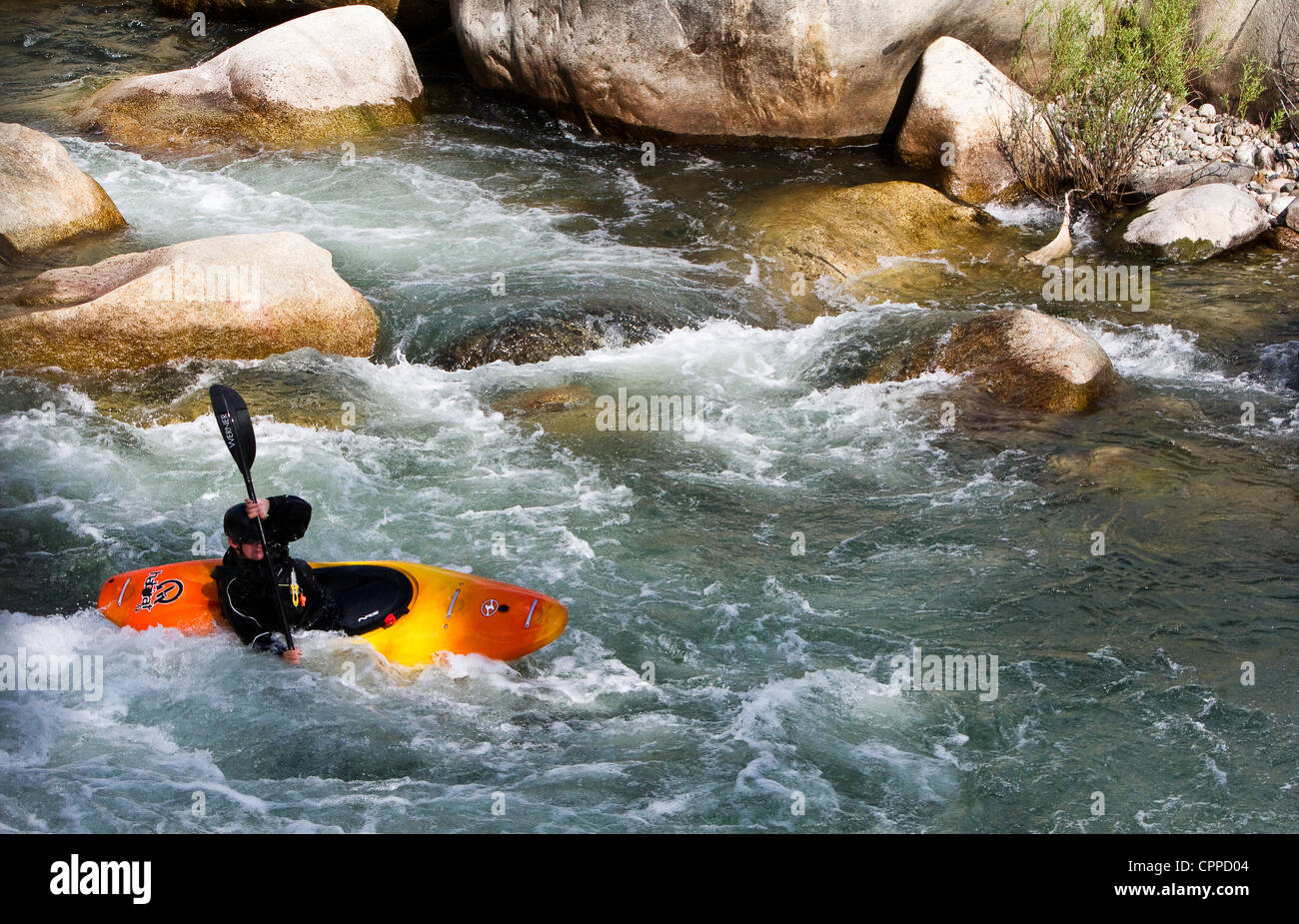 A whitewater rafter coming  down the river. Stock Photo