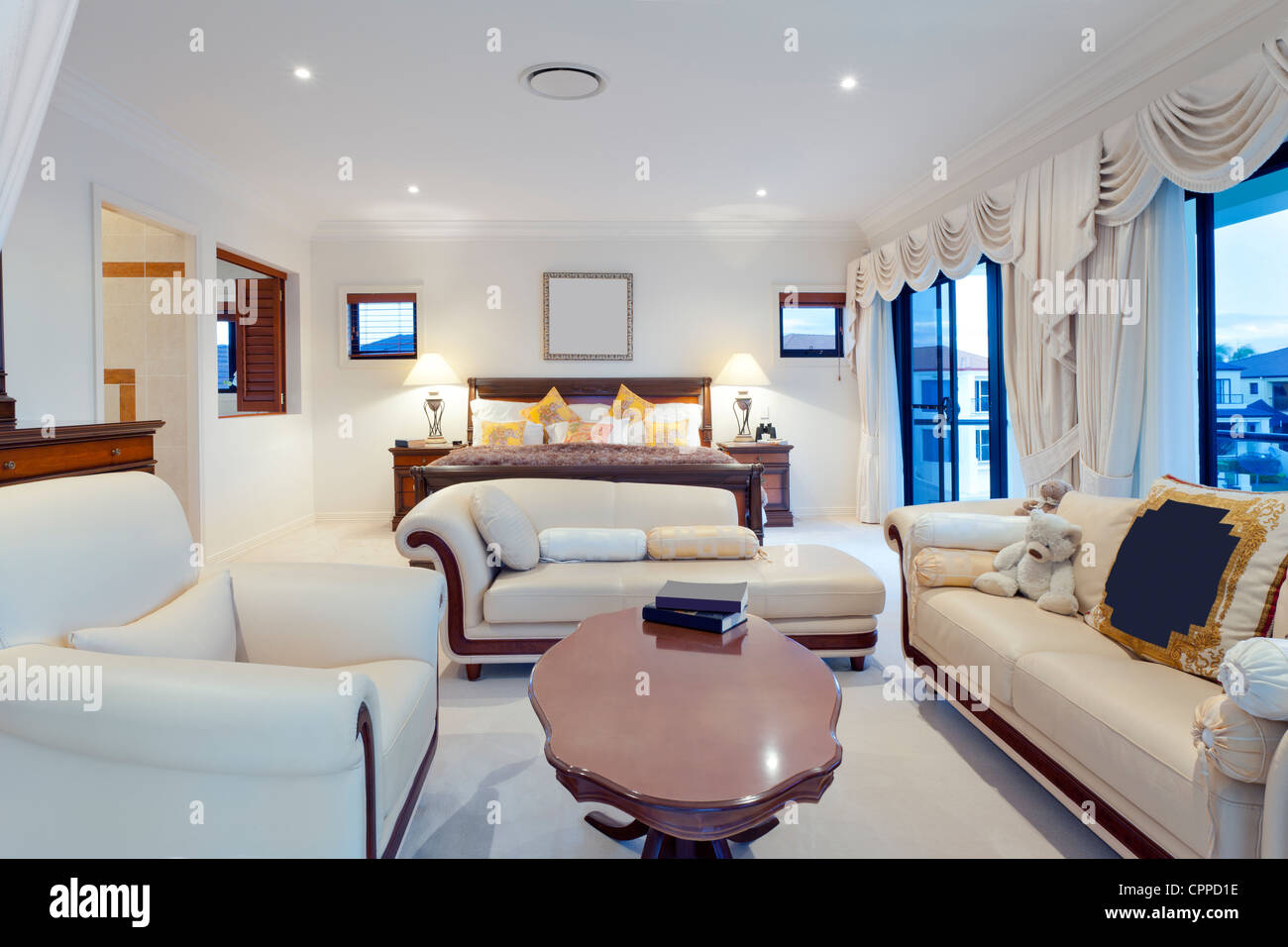 Spacious master bedroom in luxury house overlooking the water Stock Photo -  Alamy, image size:1300x956