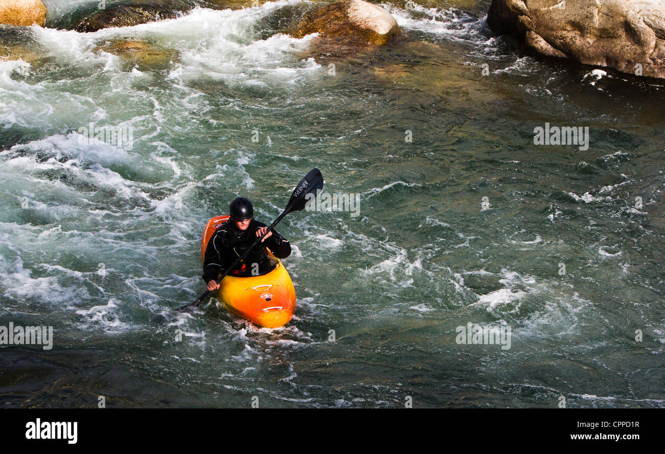 A whitewater rafter coming  down the river. Stock Photo