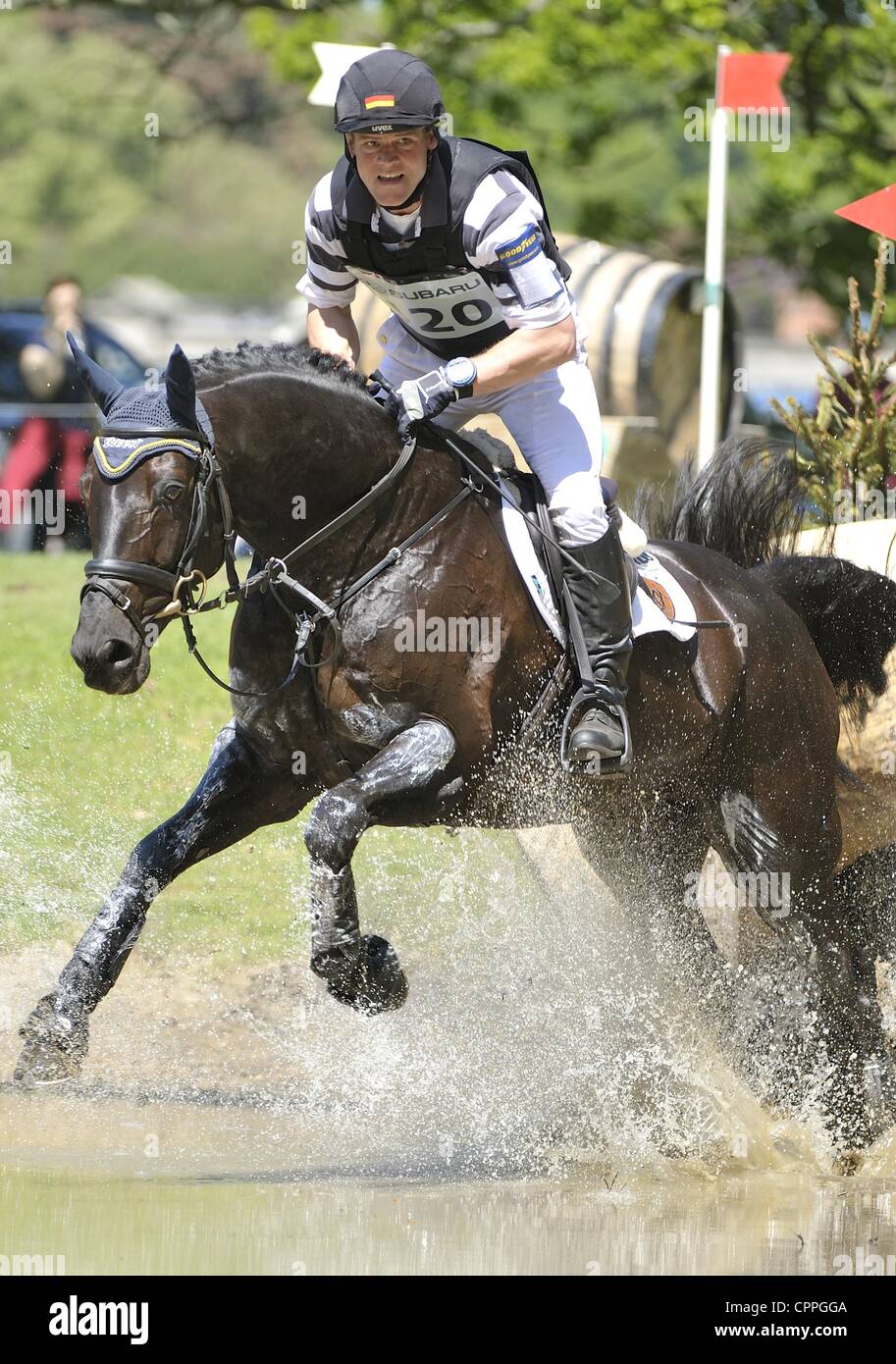 26.05.2012 Houghton Hall, England. Andreas Ostholt (GER) FRANCO JEAS in action during the Cross Country Phase at the Subaru Houghton International Horse Trials. Stock Photo