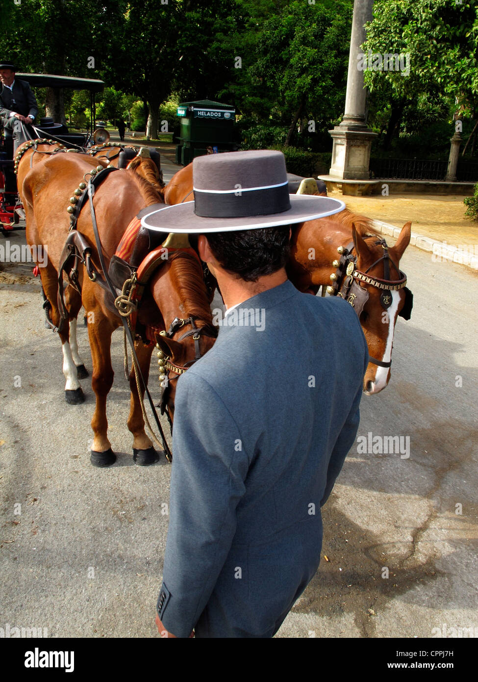 Spain Andalusia Seville Spaniard Spanish man wear cordobes Hat with his horsecart Stock Photo