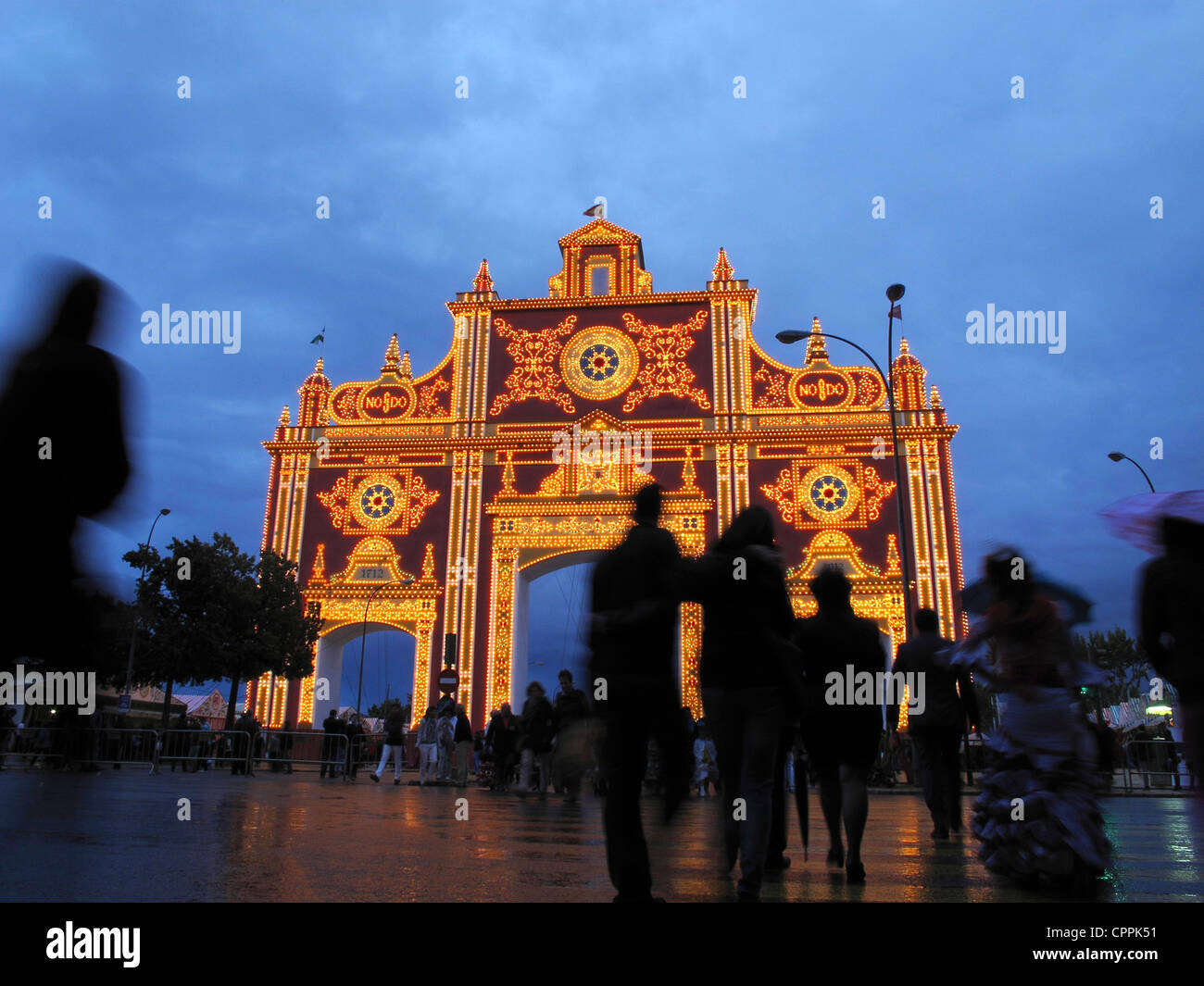 Andalusia Seville April Fair entrance in rain at dusk Stock Photo Alamy