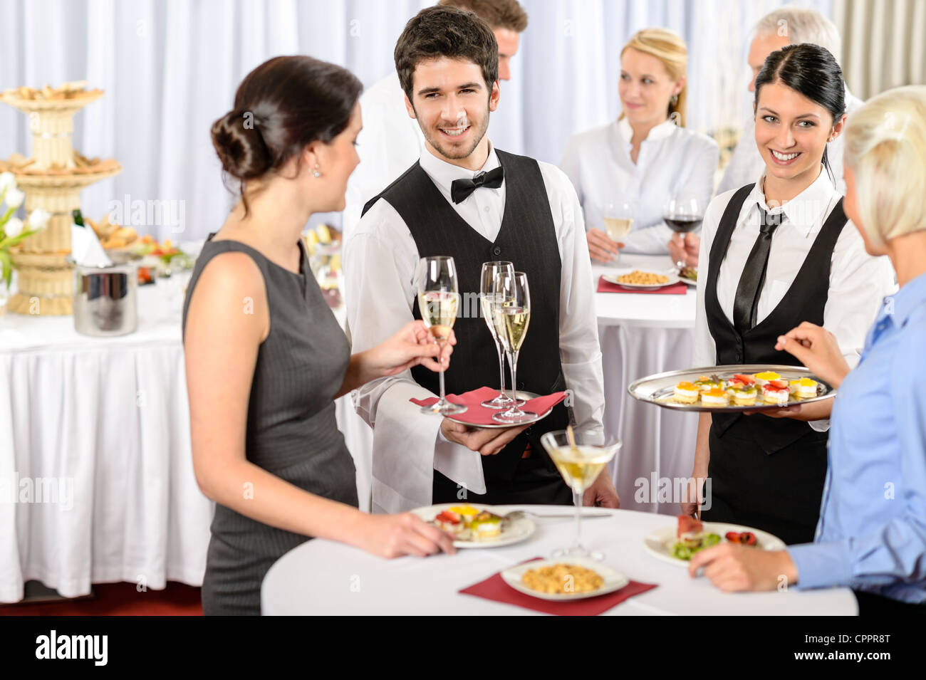 Catering service at business meeting offer food refreshments to woman Stock Photo