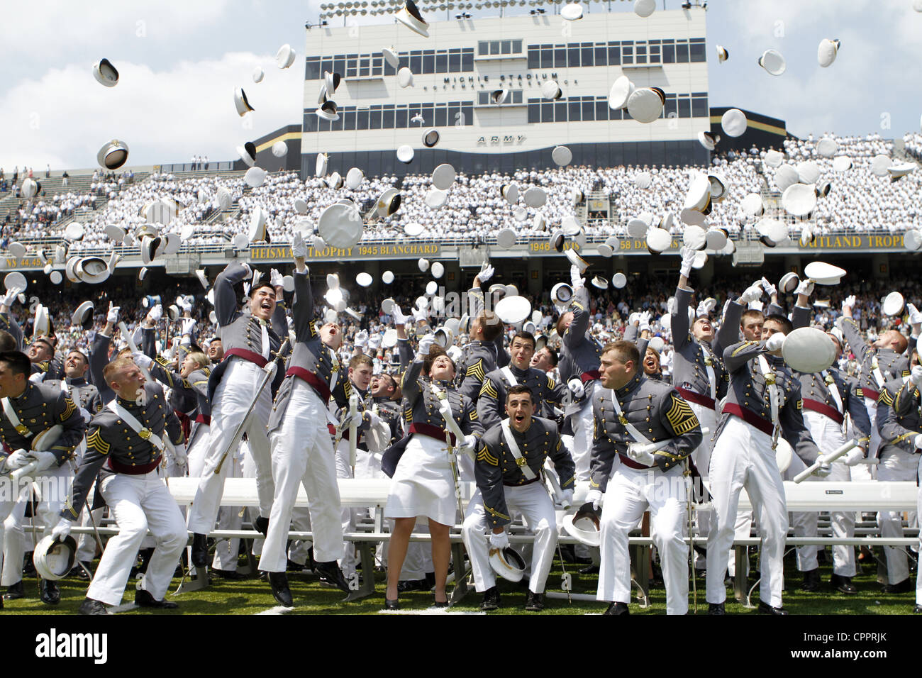 Graduating cadets from the US Military Academy class of 2012 celebrate by throwing their hats into the air during ceremonies May 26, 2012 in West Point, NY. Stock Photo