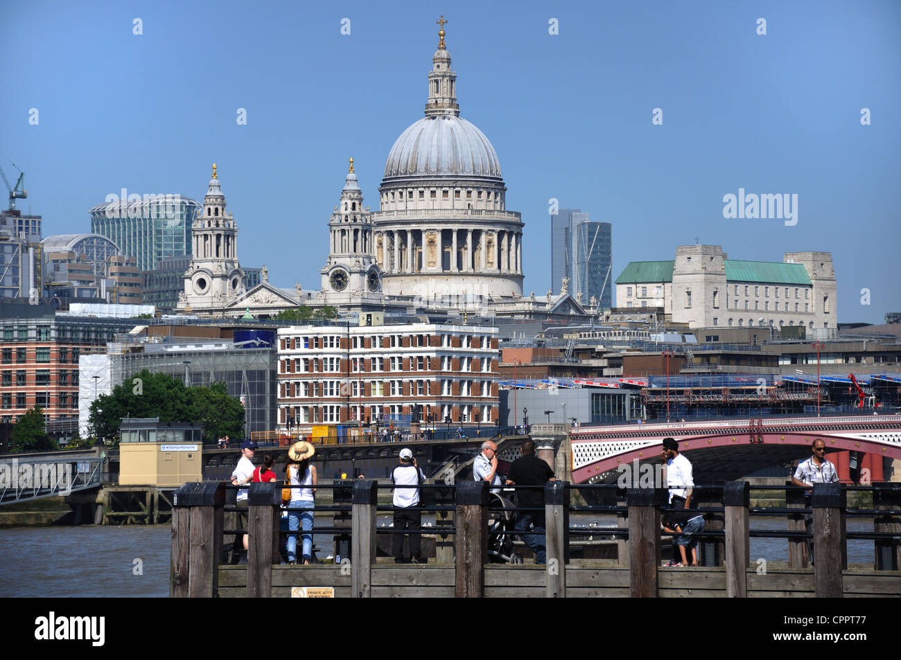 London tourists having a view of the skyline with the dome of St Paul's Cathedral taking centre stage Stock Photo