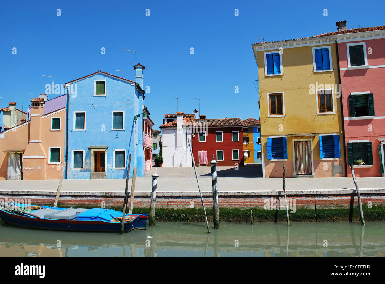 Colorful houses on the canals in Burano Island, Venice, Italy Stock ...