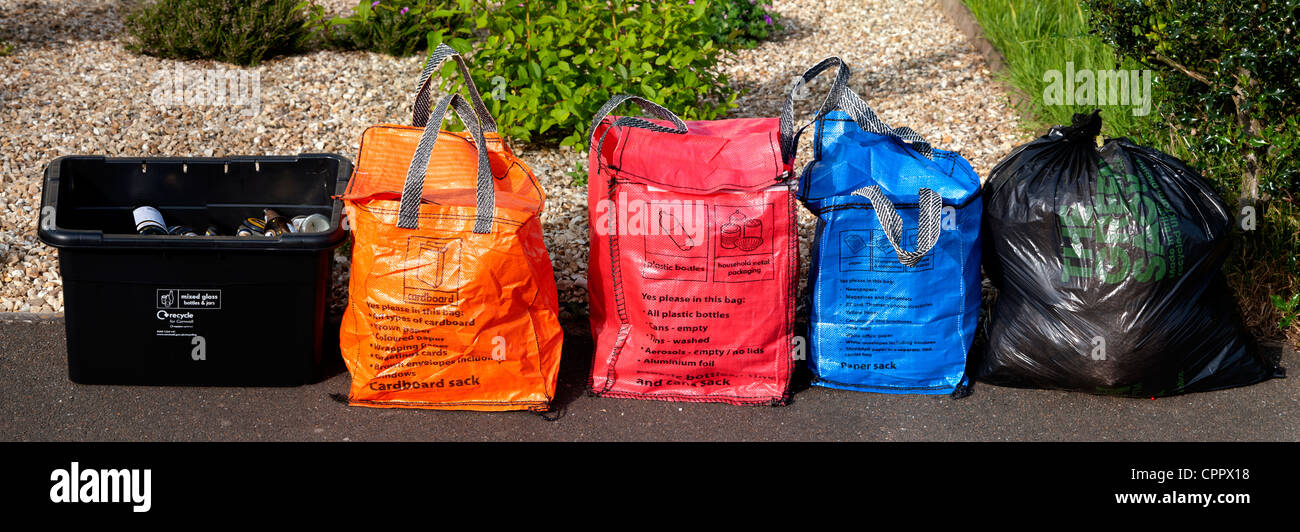 Household waste and recycling awaiting kerbside collection by Cornwall Council contractors sorted into coloured colored bags Stock Photo Alamy