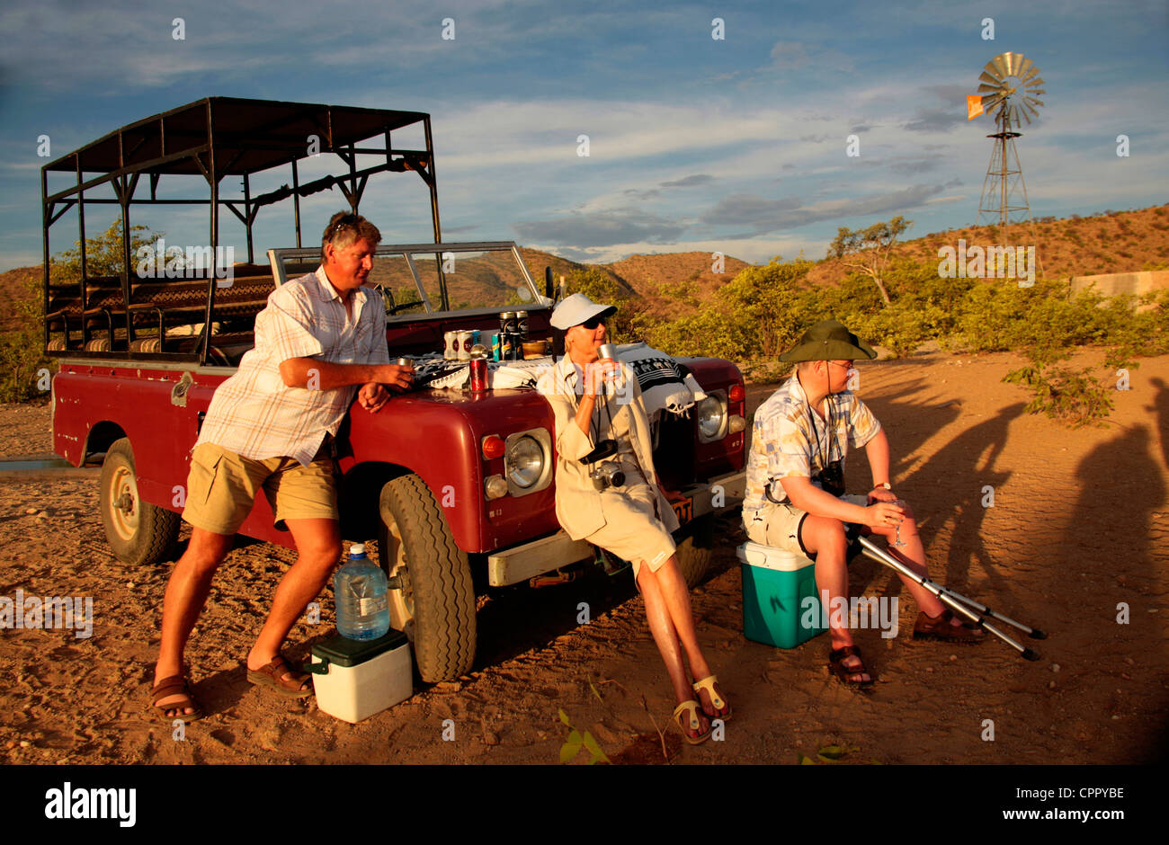 Tourists and guide prove that adventure travel in Namibia isn't just for the able bodied. Stock Photo