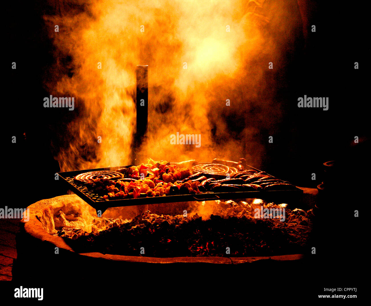 A braai over a fire pit at Kambaku Lodge Stock Photo Alamy