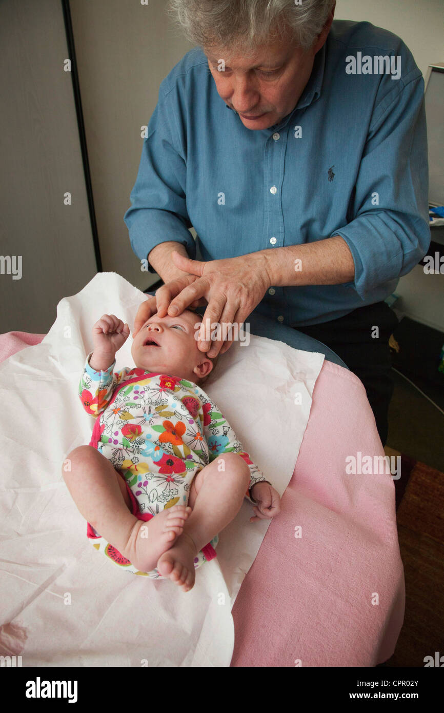 OSTEOPATHIC TREATMENT OF INFANT Stock Photo Alamy