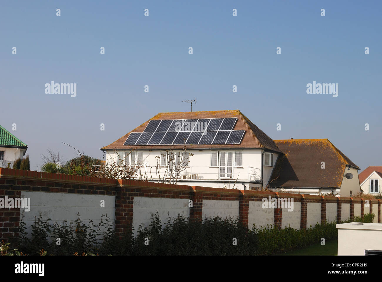 Detached house with solar panels for generating electricity on roof. Ferring. Near Worthing