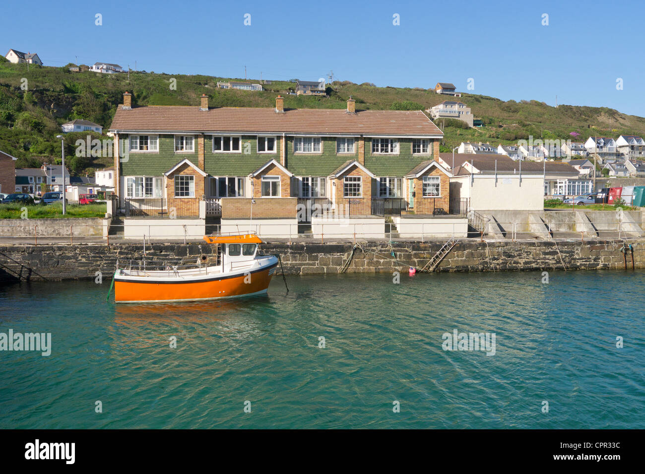 Portreath harbour and harbourside houses near high tide.  Cornwall UK. Stock Photo