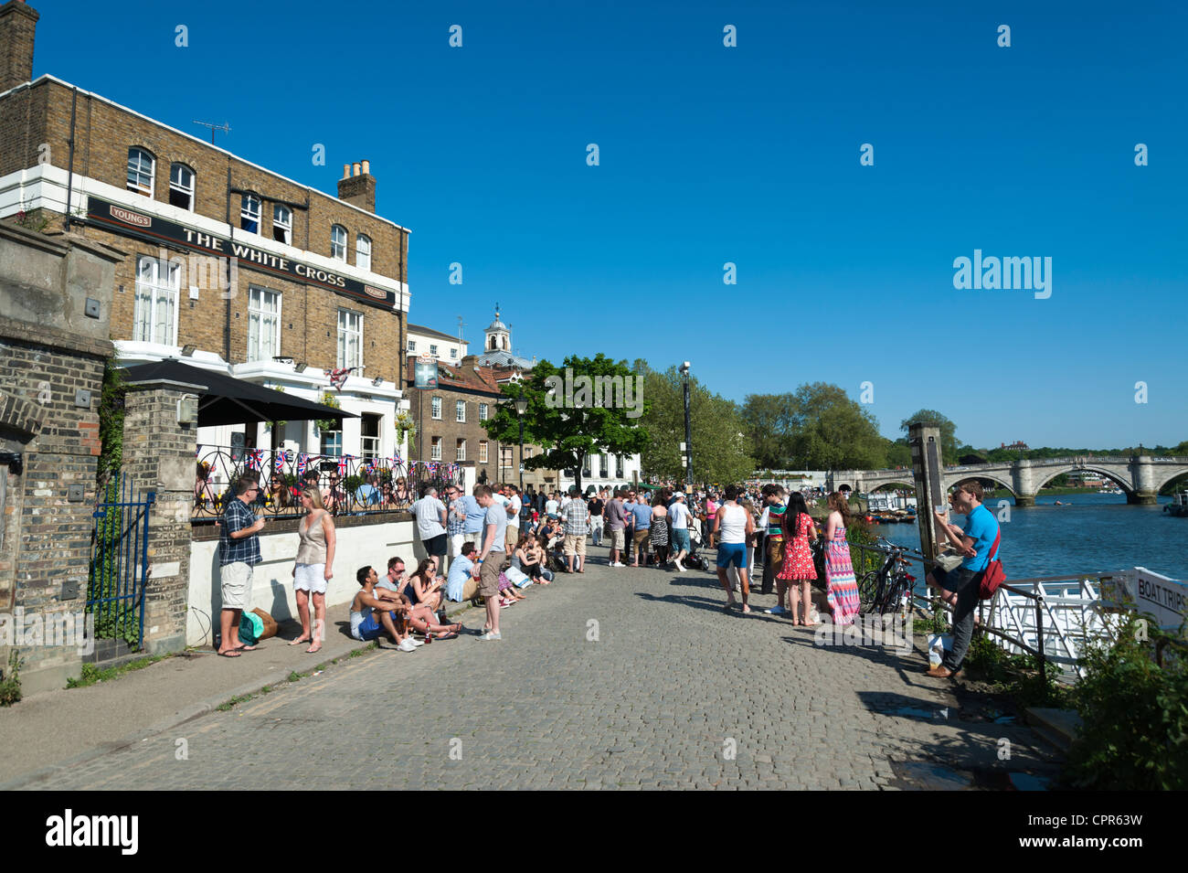 The White Cross pub Richmond on Thames London UK on a summer day with people relaxing outside in the sunshine Stock Photo