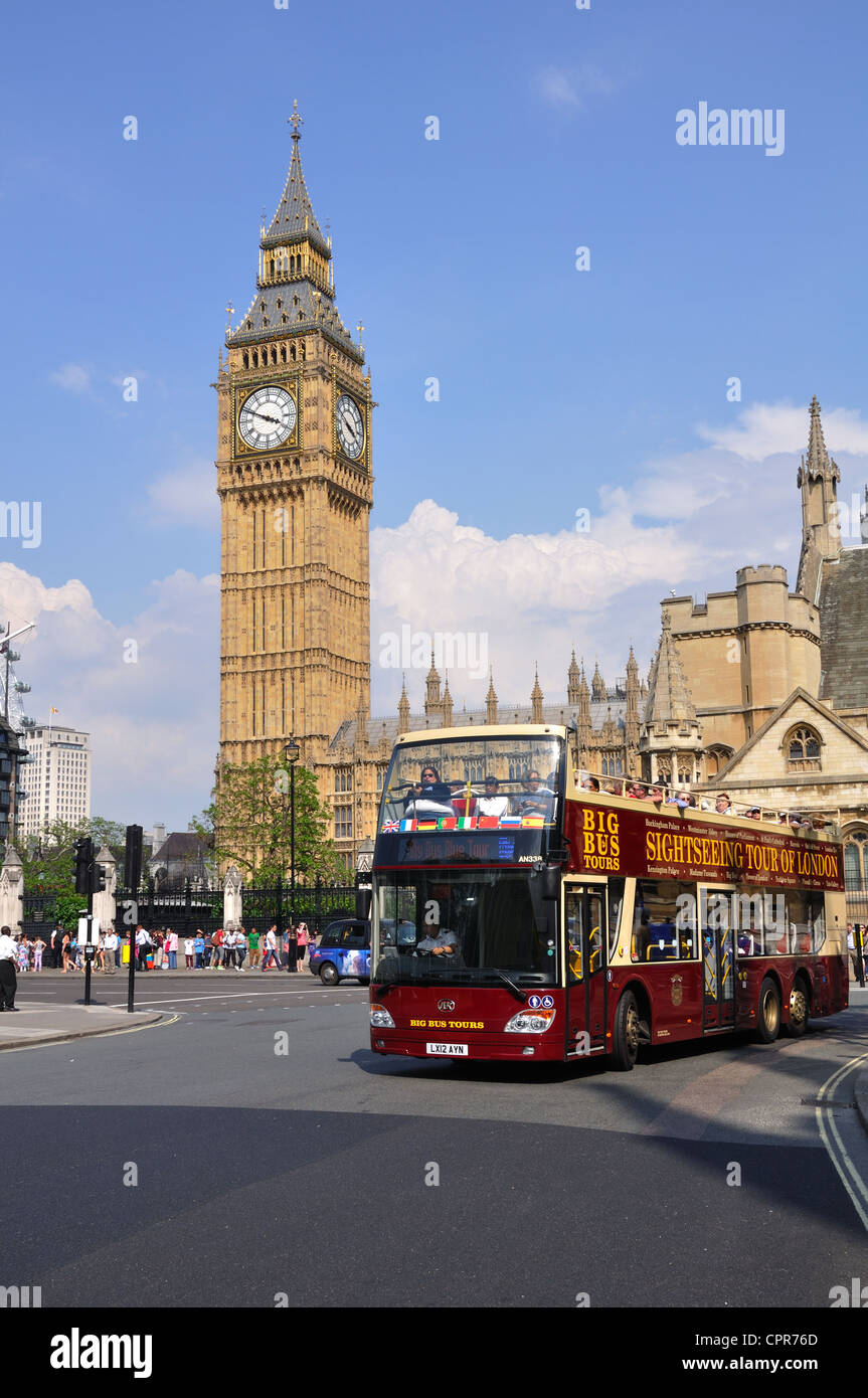Open top tourist bus in front of Big Ben, London, UK Stock Photo