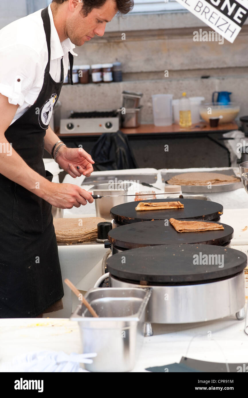 Paris, France - French man making crepes Stock Photo