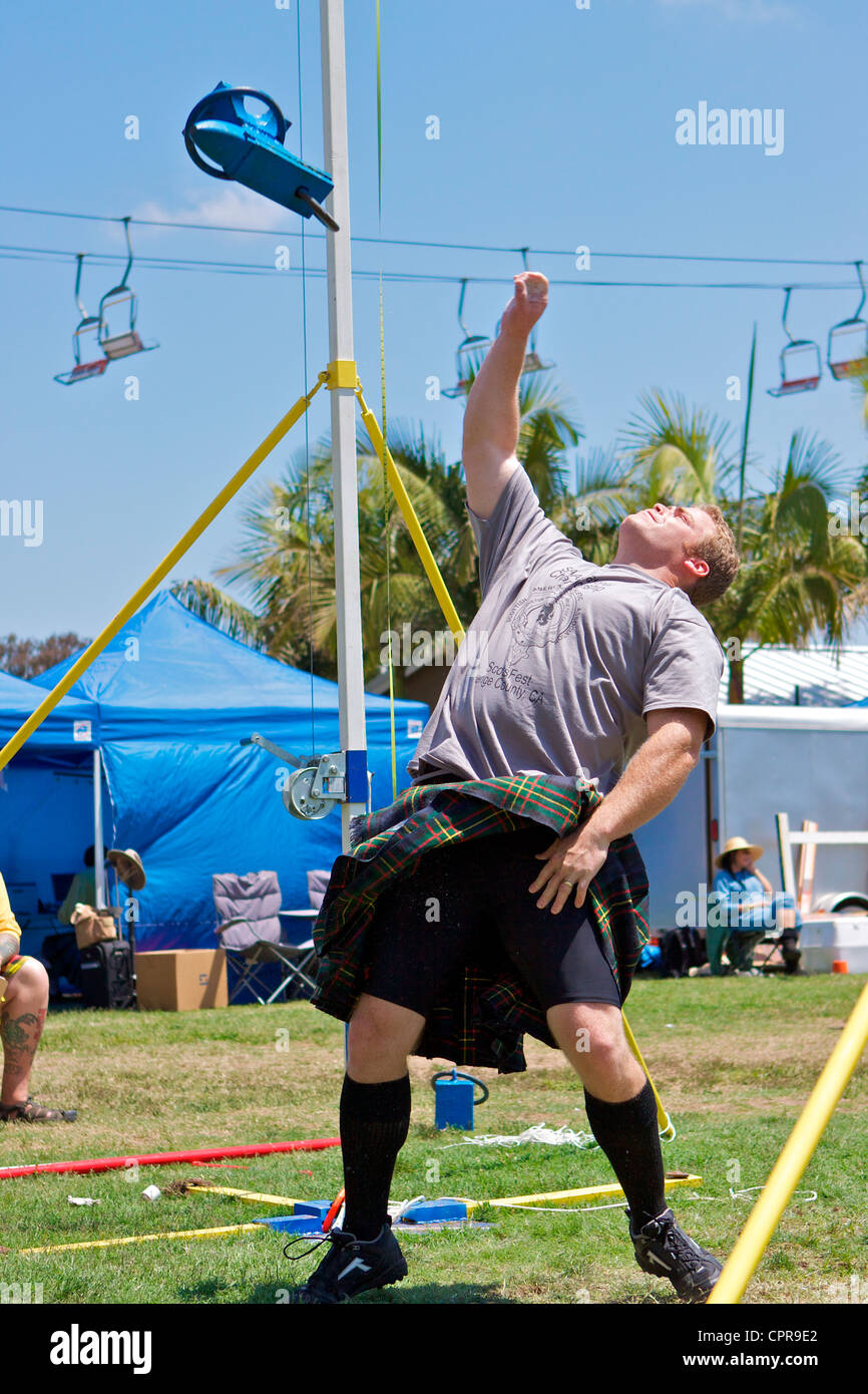 Athletes in kilts throwing the anvil at the American Scottish Festival