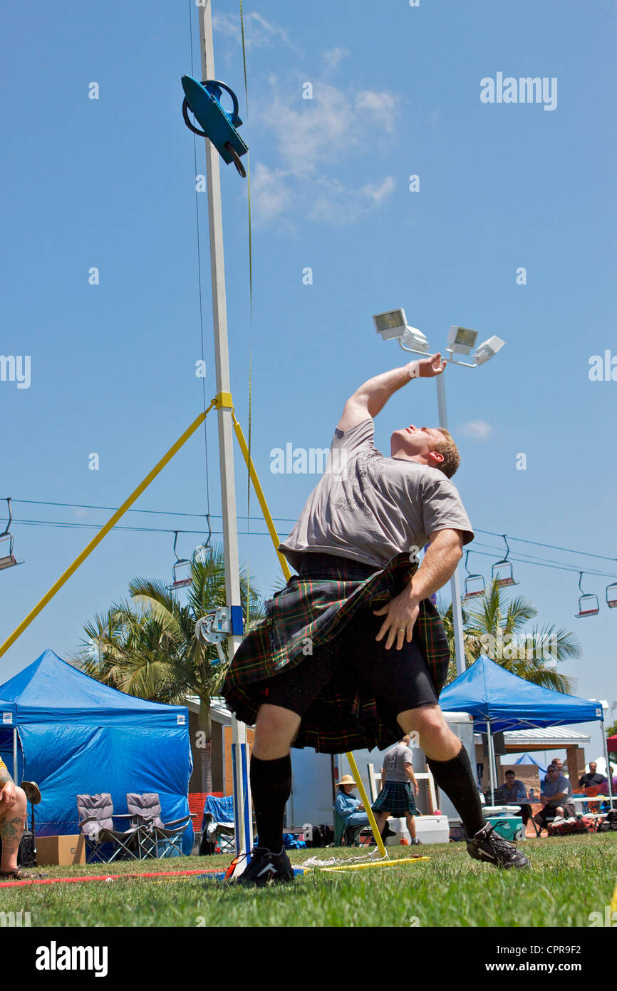 Athletes in kilts throwing the anvil at the American Scottish Festival
