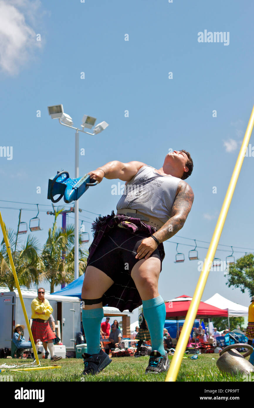 Athletes in kilts throwing the anvil at the American Scottish Festival