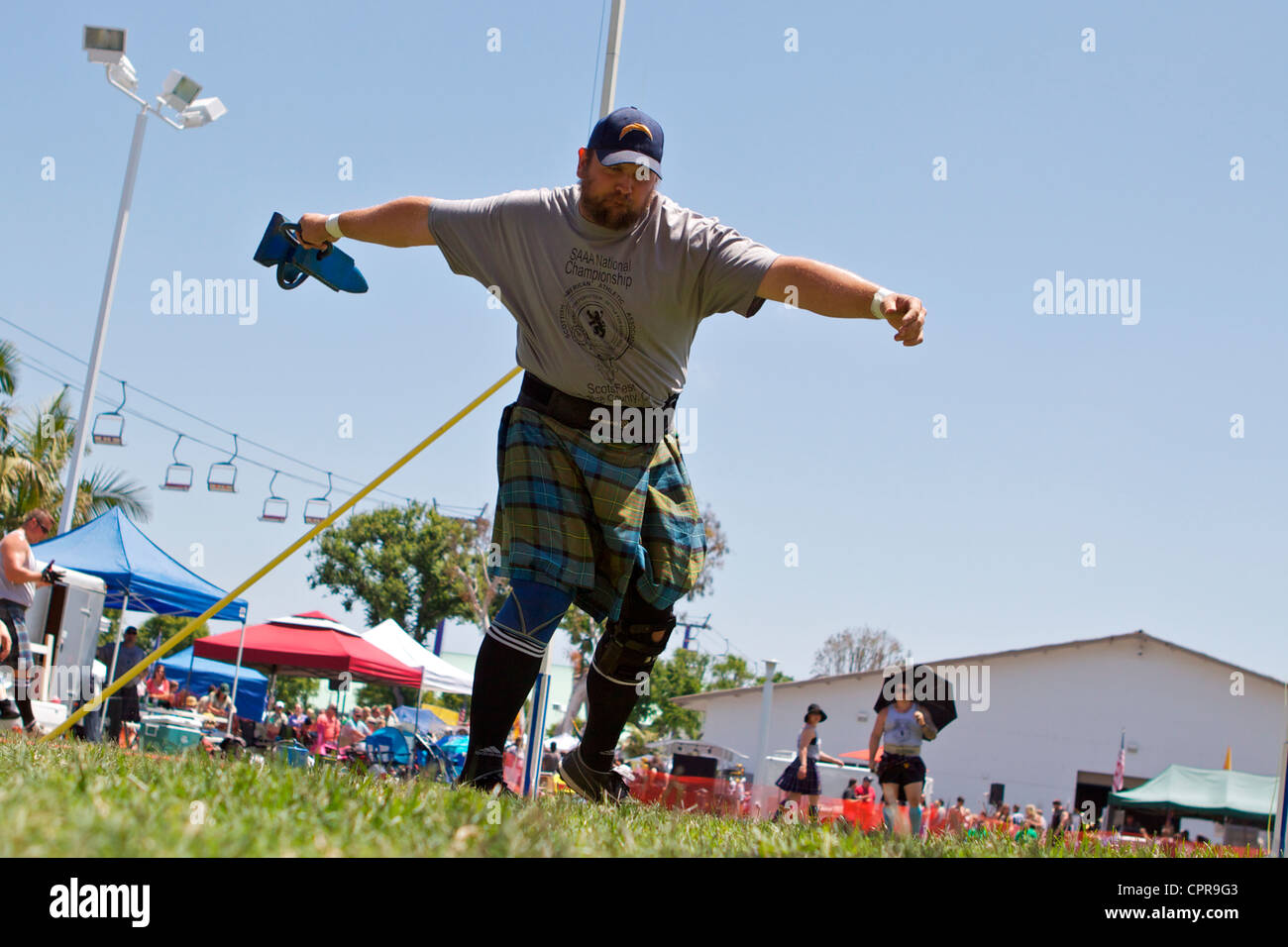 Athletes in kilts throwing the anvil at the American Scottish Festival