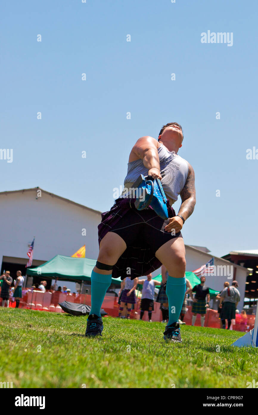 Athletes in kilts throwing the anvil at the American Scottish Festival