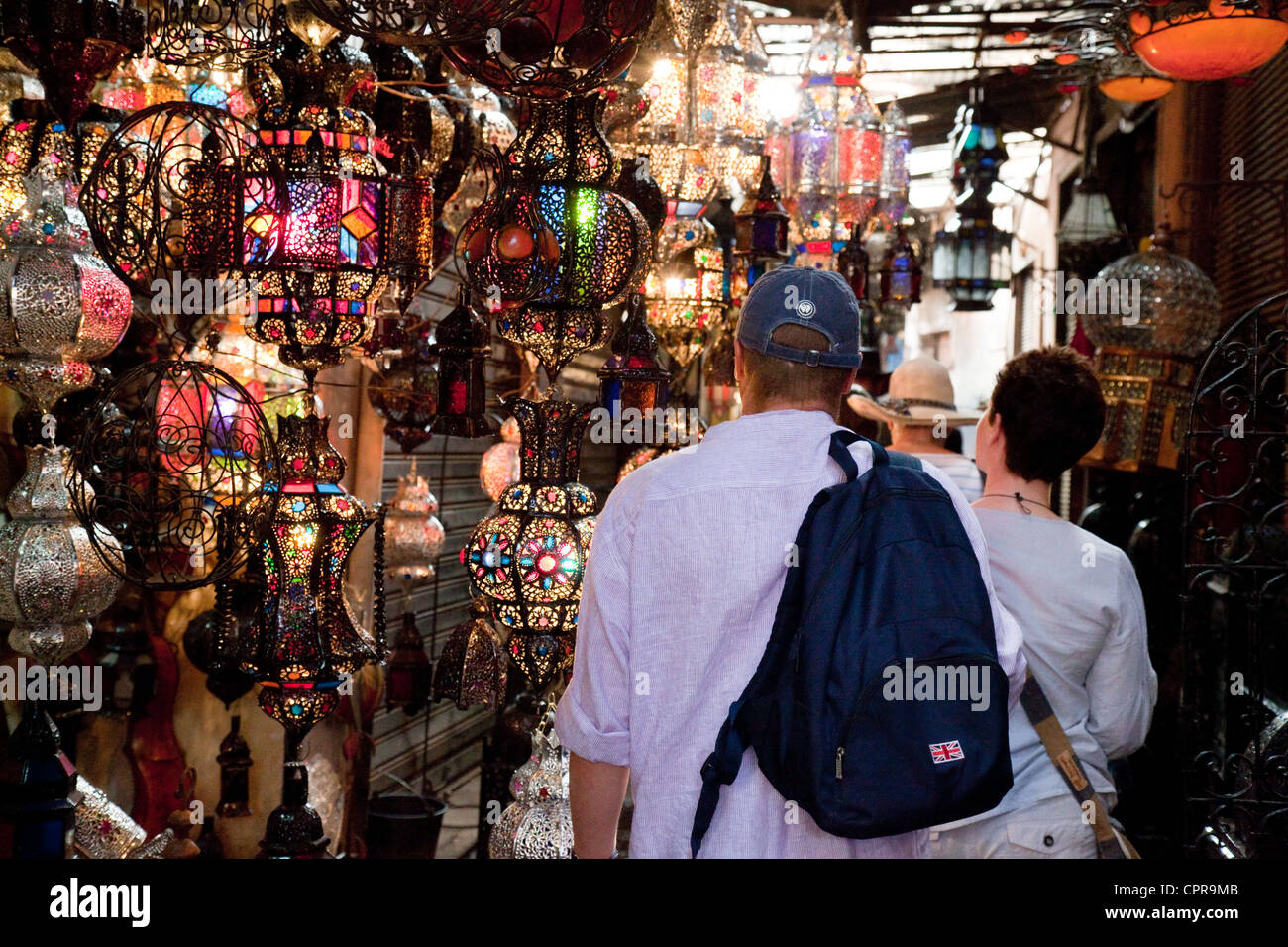 Western tourists shopping in the market (souk), marrakech, Morocco, Africa Stock Photo