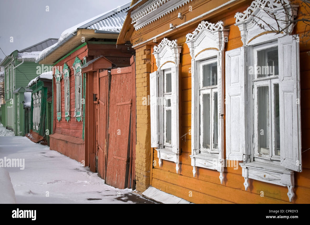 Street with old Russian wooden houses at winter in historical town Kolomna, Moscow Region, Russia Stock Photo