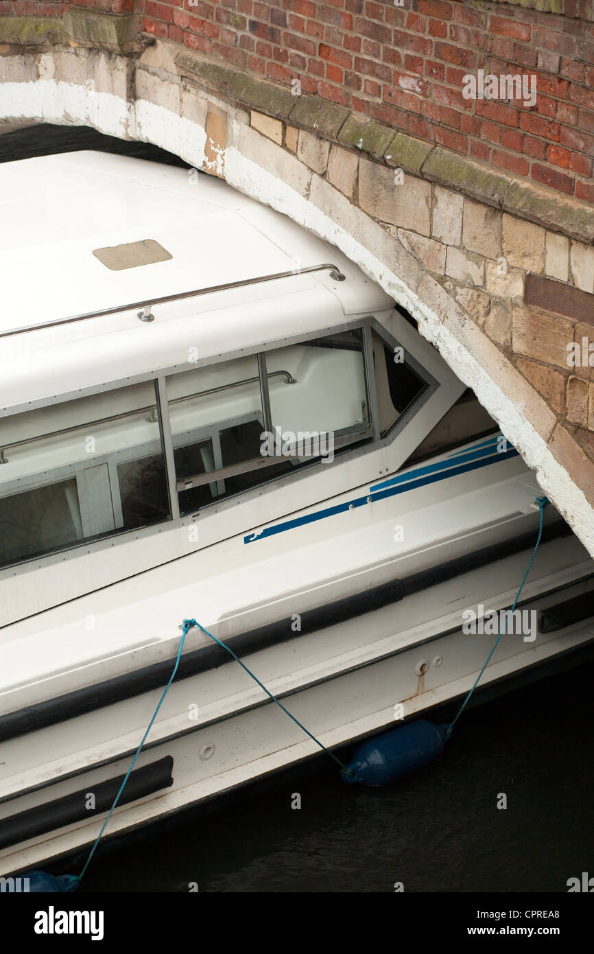 Broads cruiser stuck under Wroxham bridge, Norfolk Broads, UK Stock Photo