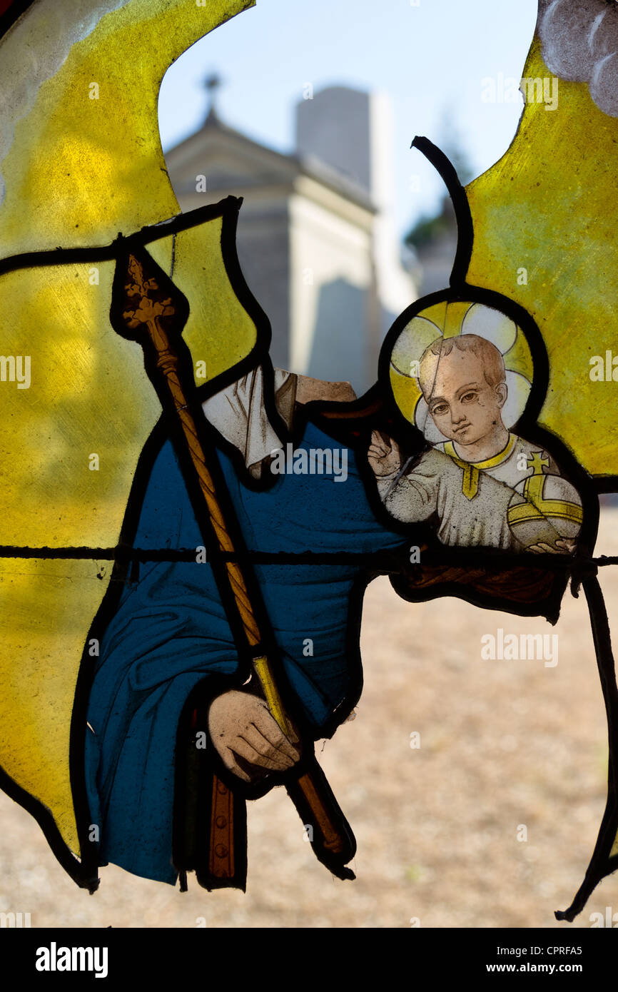 Broken stained glass window at Cimetière monumental de Rouen, France