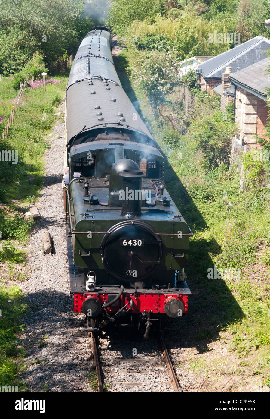 A steam training passing Blake Hall station on the heritage Ongar to Epping Railway Stock Photo