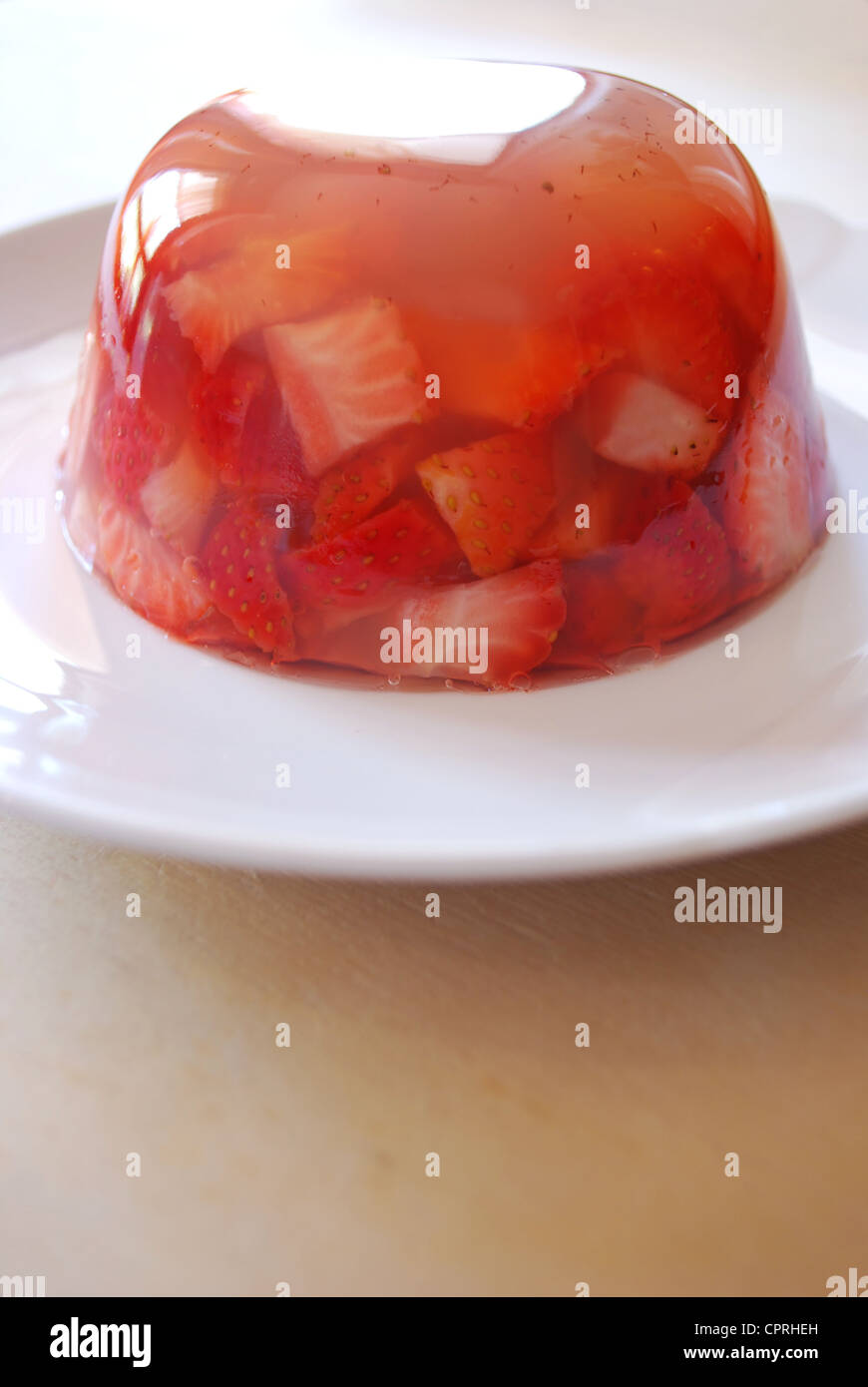 Jelly with fresh strawberries made with apple juice and agar agar on a