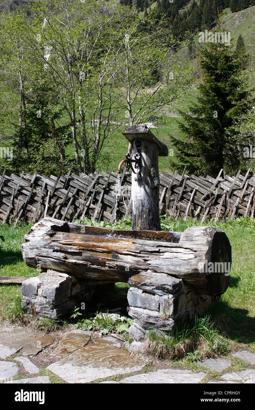 Old wooden water pump in the Austrian Tyrol.Austria. Stock Photo
