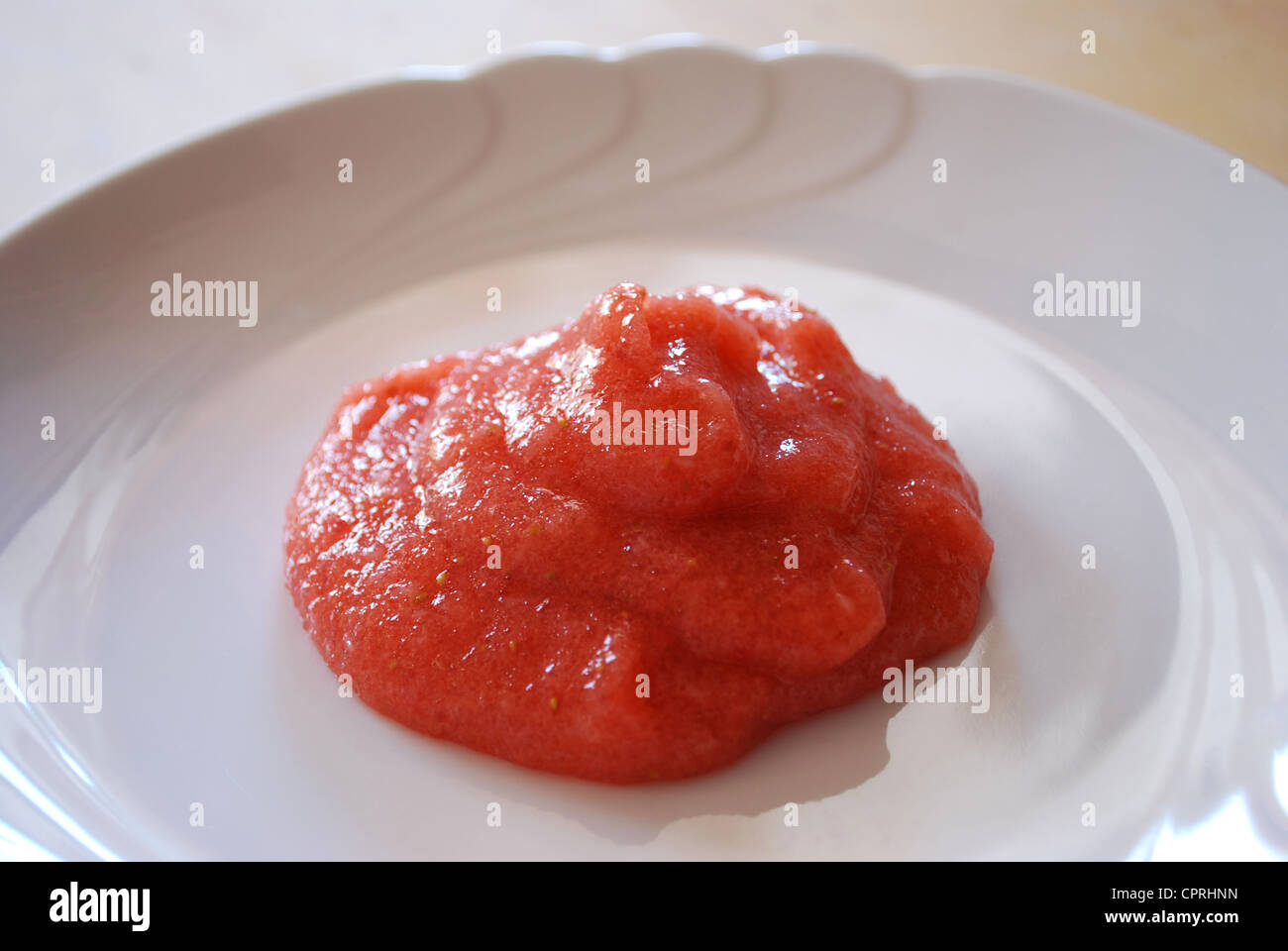 Jelly with fresh strawberries made with apple juice and agar agar on a