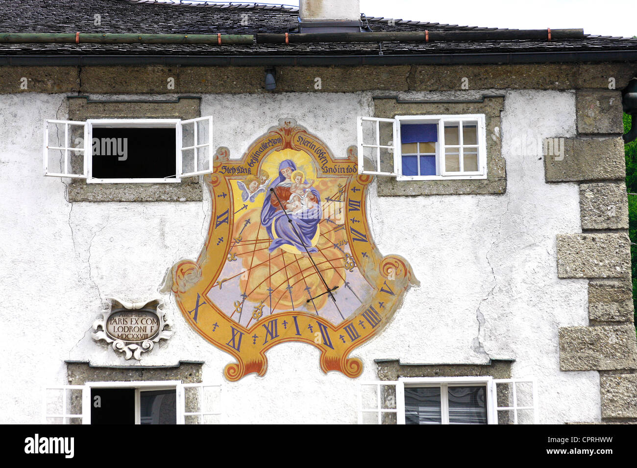 Large sundial on the front wall of a house in  Mozart Square ,Salzberg, Salzburg,Austria. Stock Photo