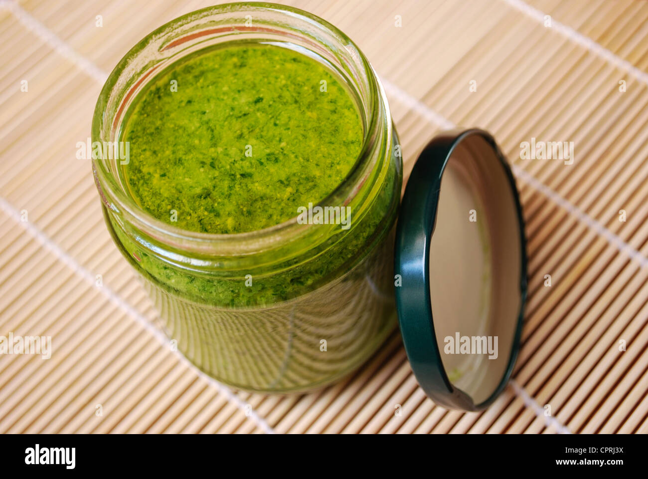 Fresh basil pesto, typical italian green sauce dressing for pasta Stock