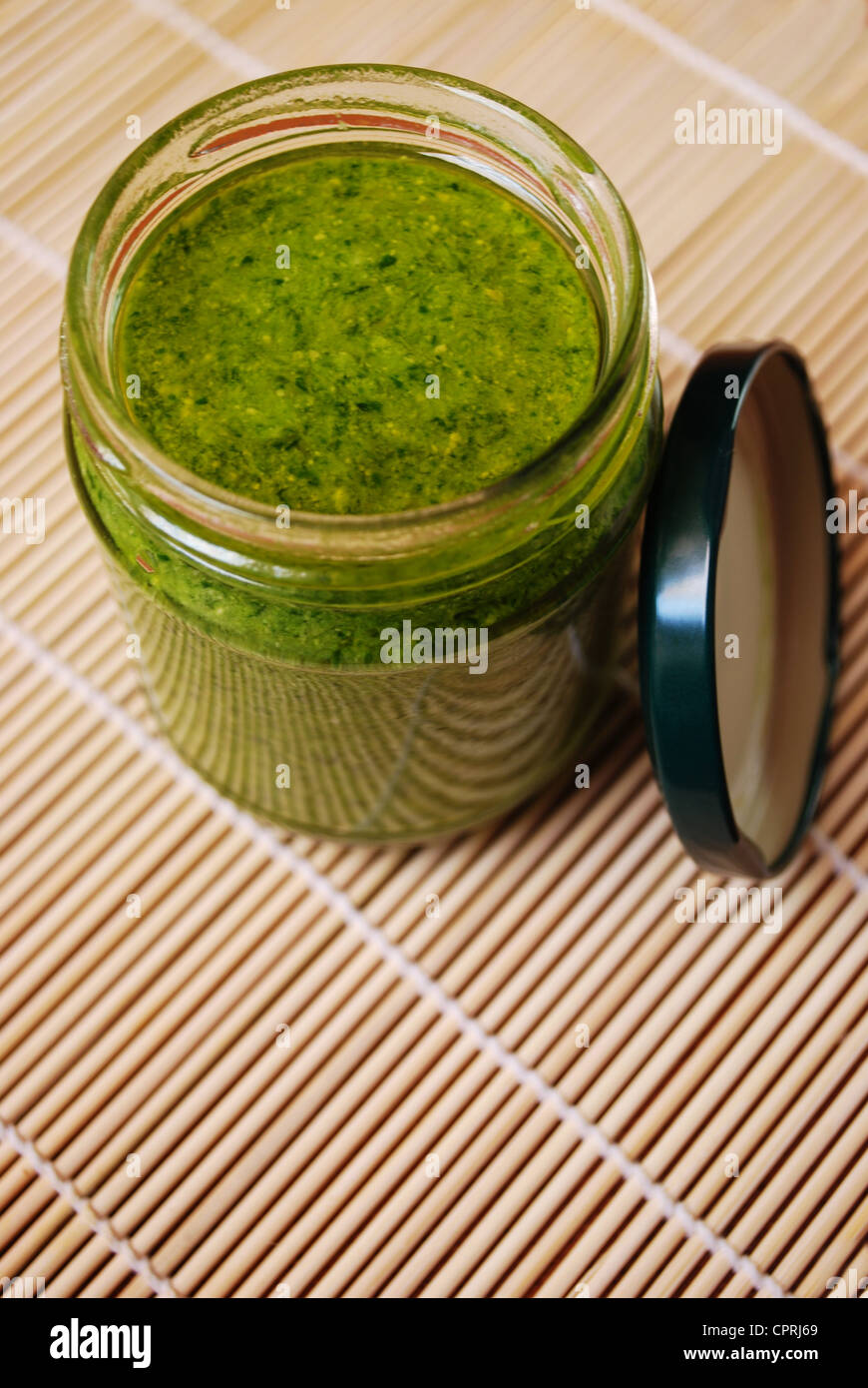 Fresh basil pesto, typical italian green sauce dressing for pasta Stock