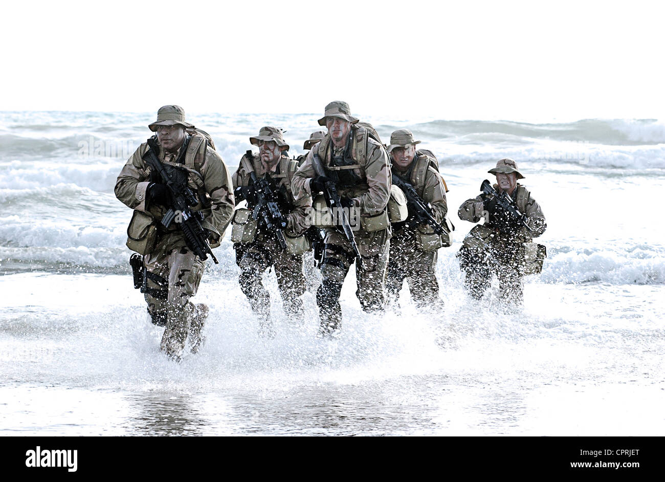 US Navy SEALs practice beach landings during combat training Stock Photo