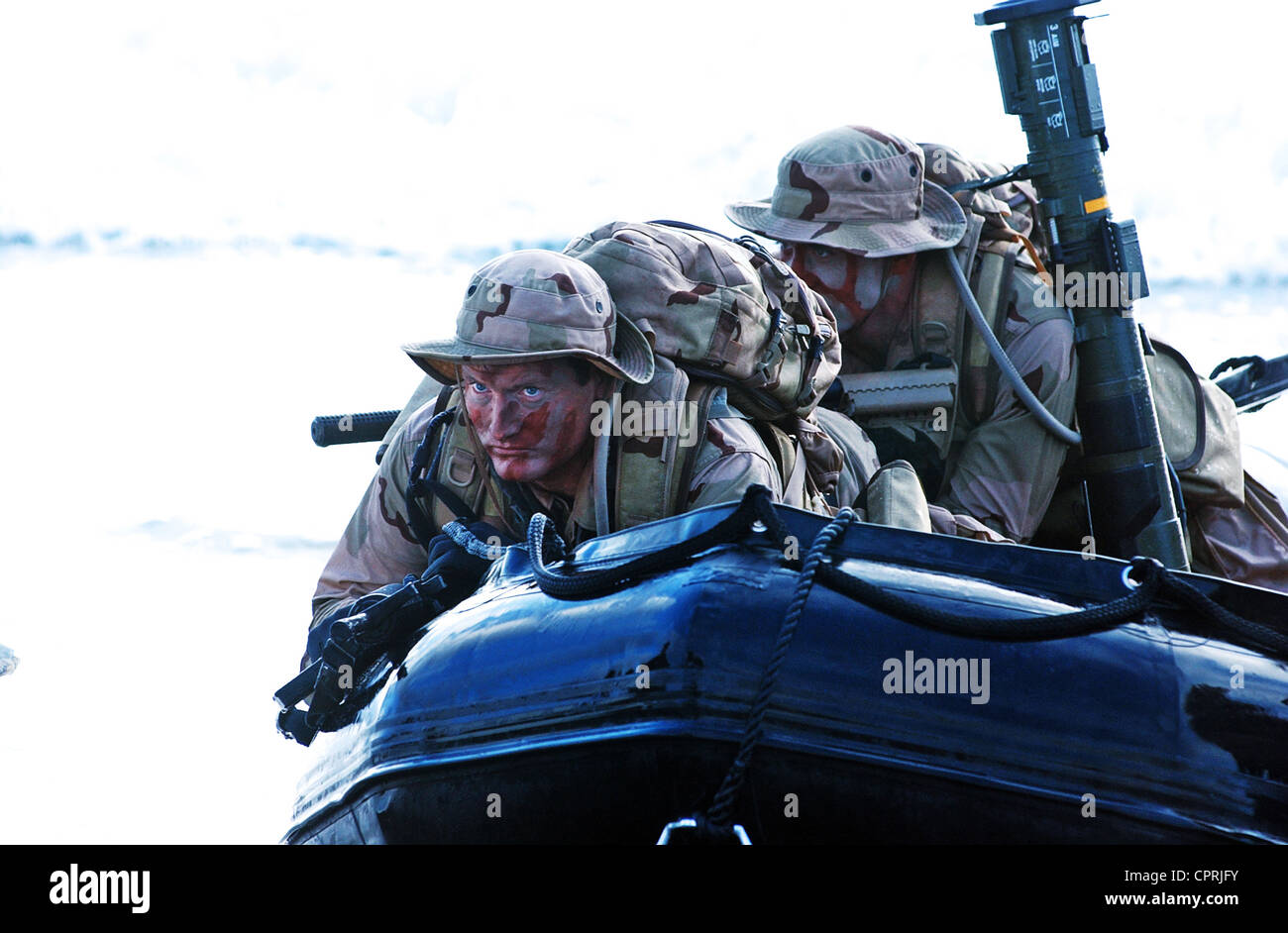 US Navy SEALs practice beach landings during combat training Stock