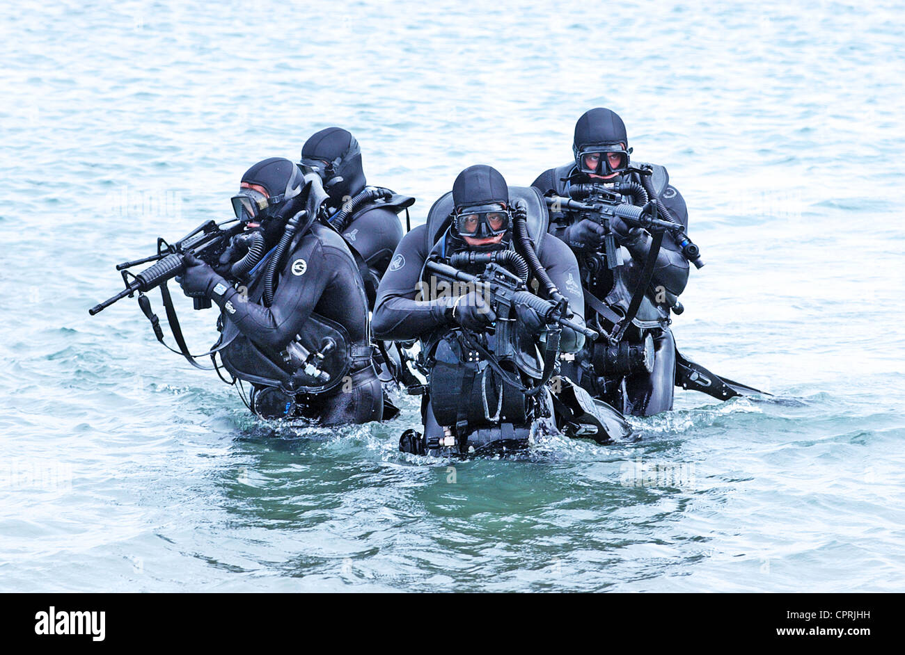 US Navy SEALs practice beach landings during combat training Stock Photo