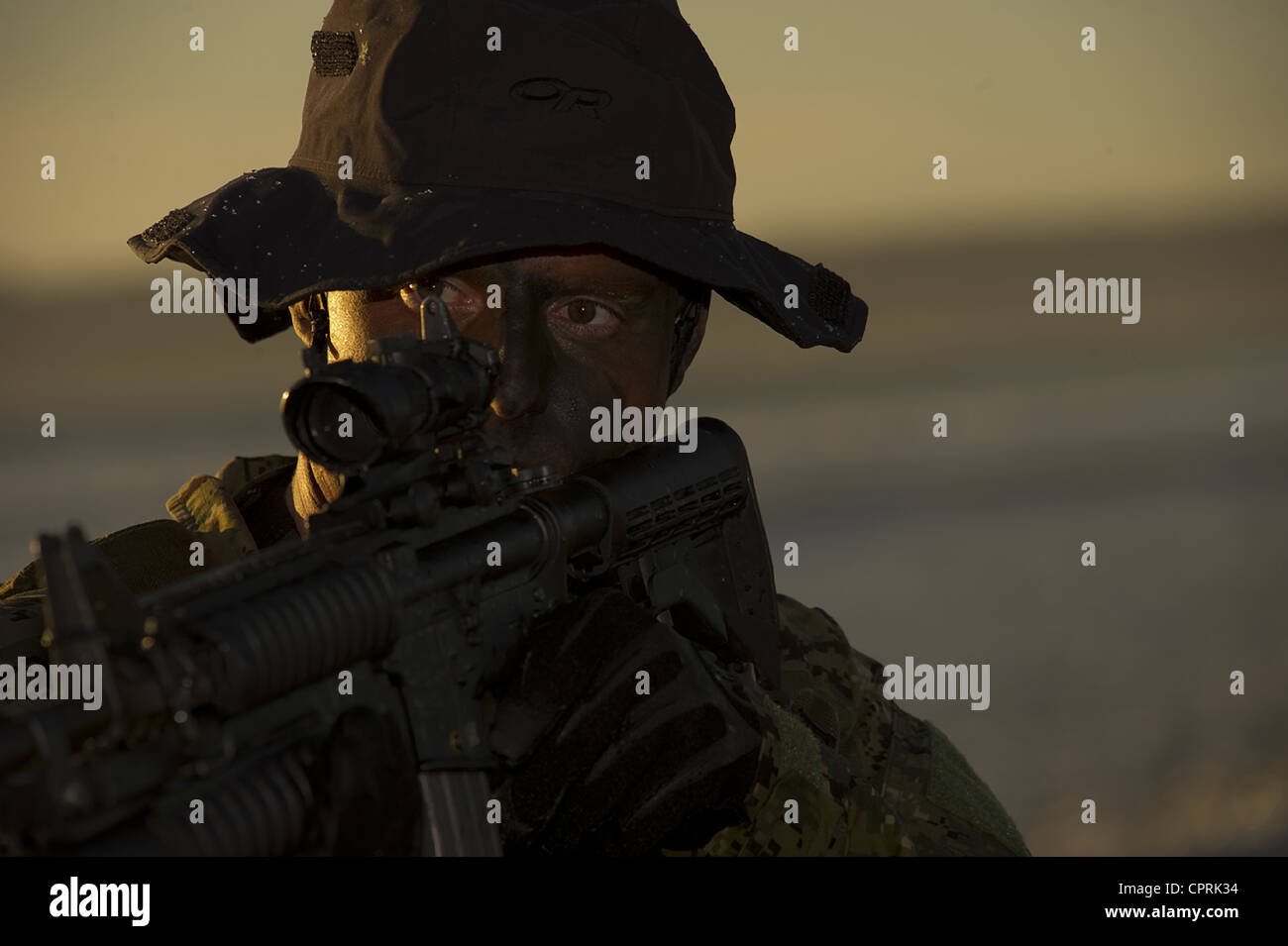 A US Navy SEAL during water training at sunset January 9, 2012 in Coronado, CA. Stock Photo