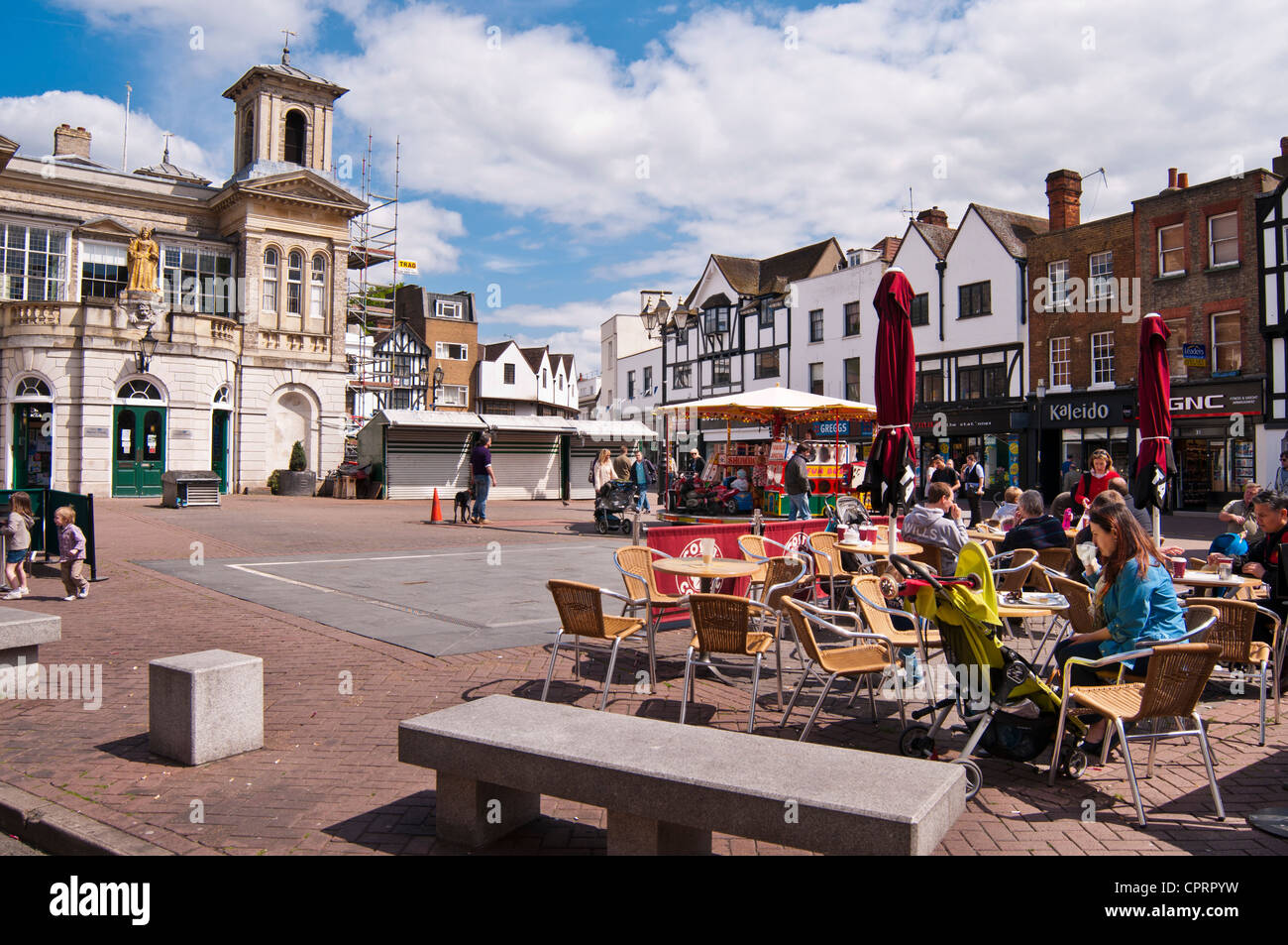 People enjoying sunny morning in pavement cafe, Market Place, Kingston upon Thames, Surrey, UK Stock Photo