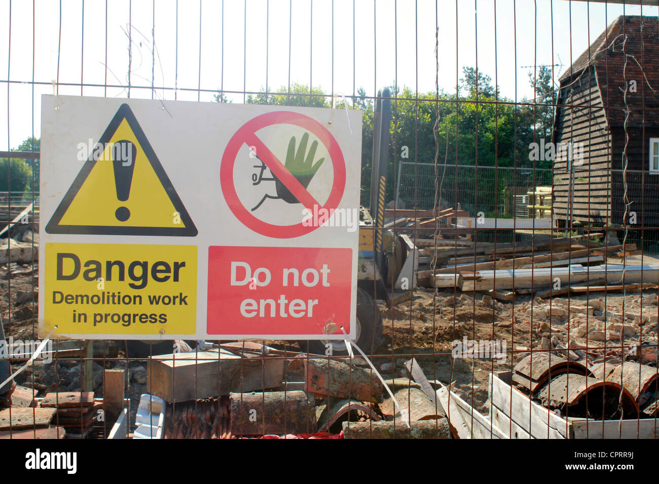A warning sign warns of a demolition site Stock Photo
