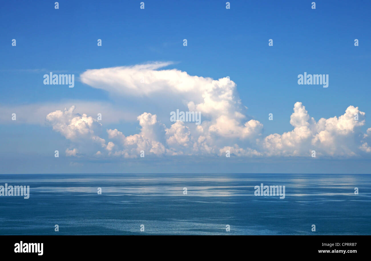 Blue sky and white clouds over calm sea Stock Photo - Alamy
