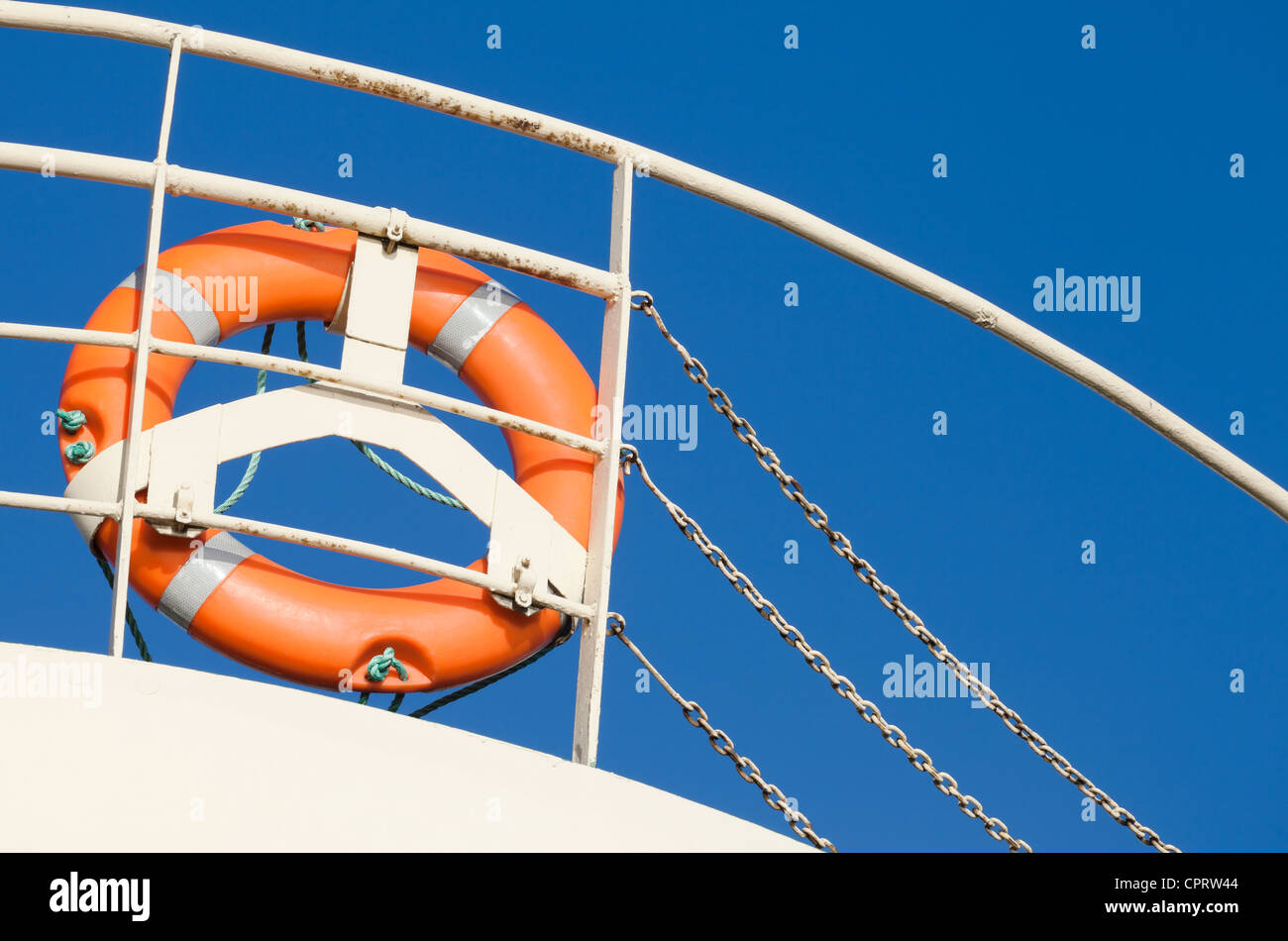Lifebuoy on the naval railing above blue sky Stock Photo - Alamy